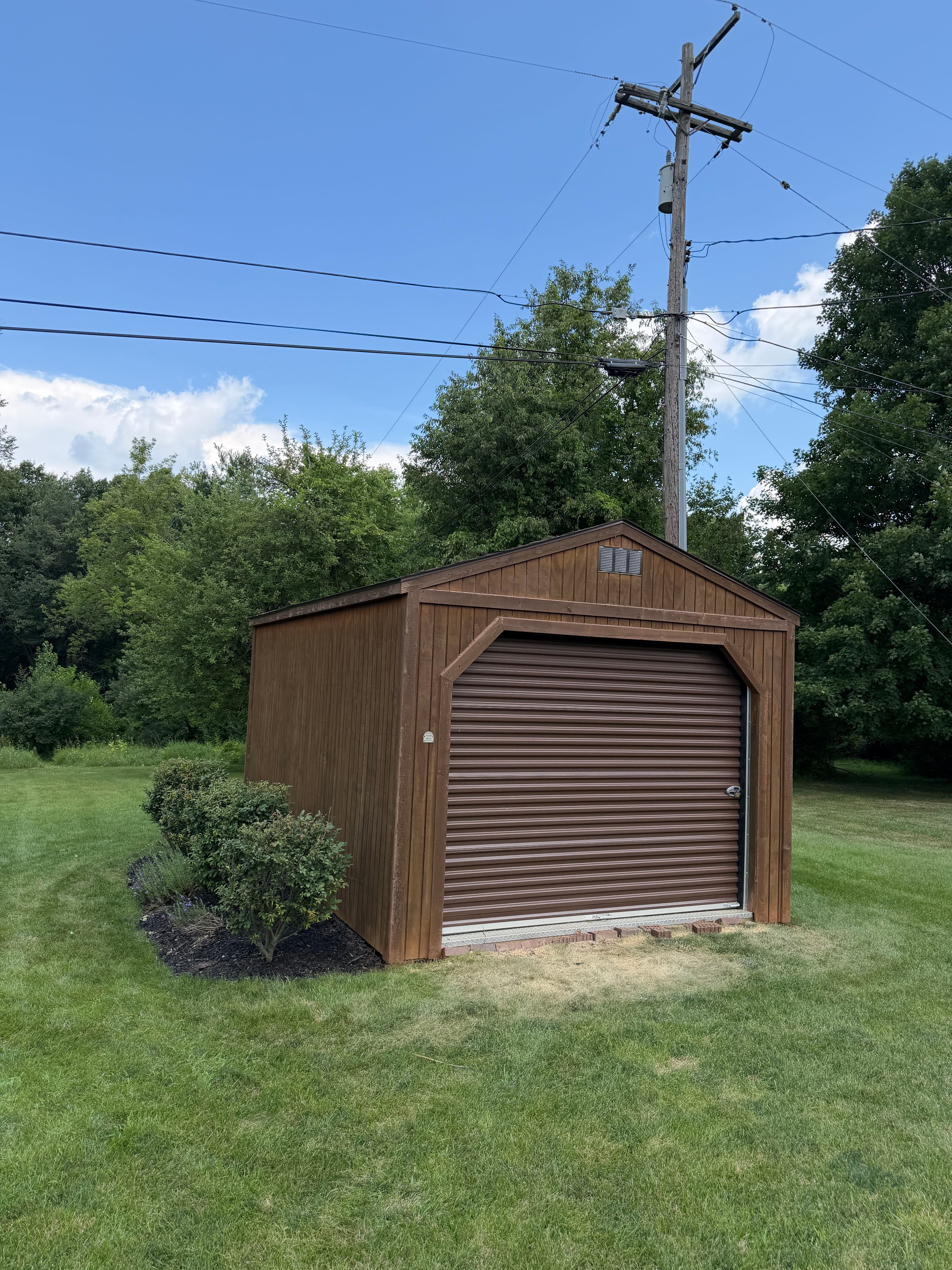 Project Shed Re-Stain Before and After on a Prayer Chapel Property image