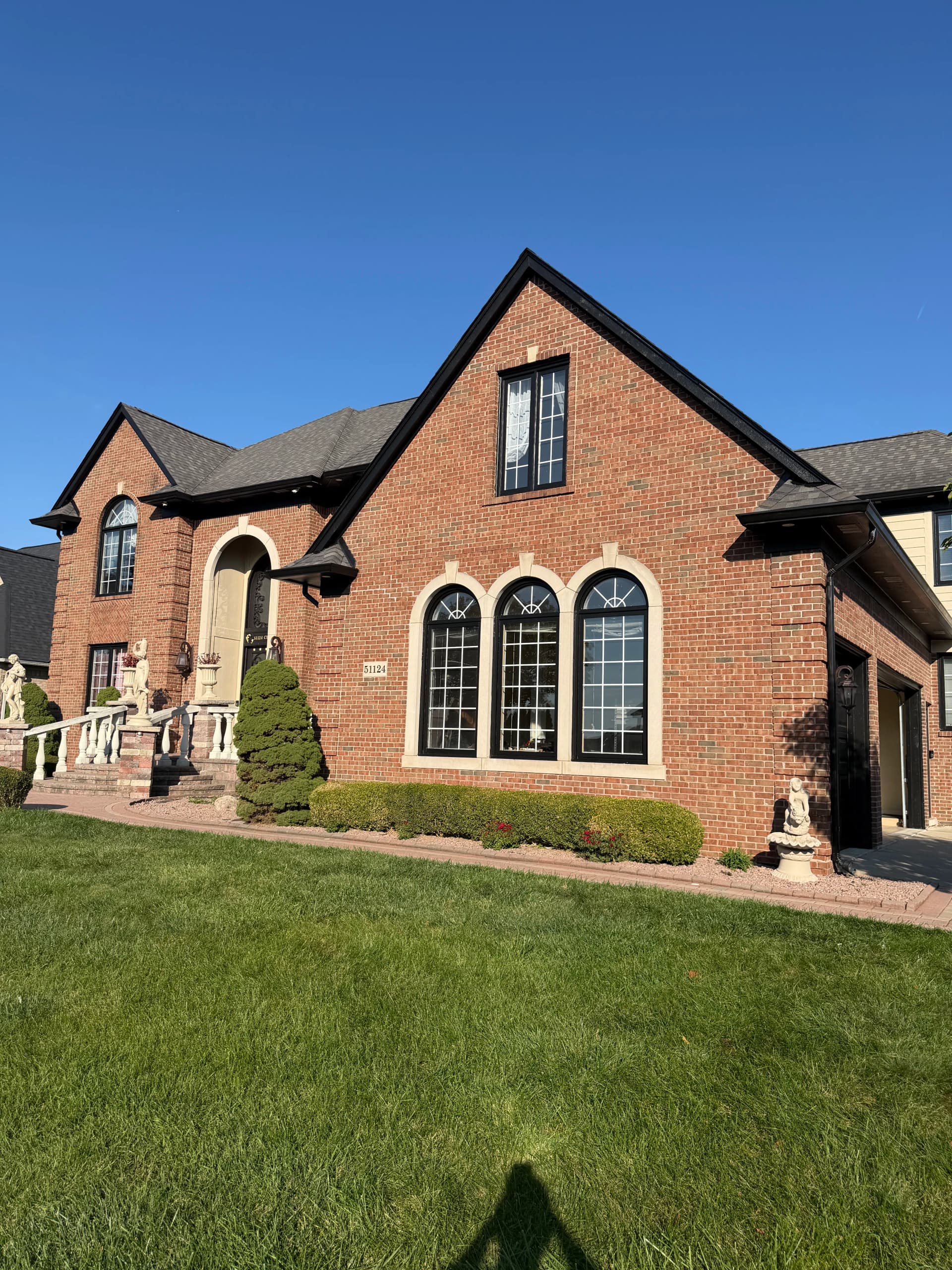 Clean 2-Tone Exterior Finish on a Large Brick Home image